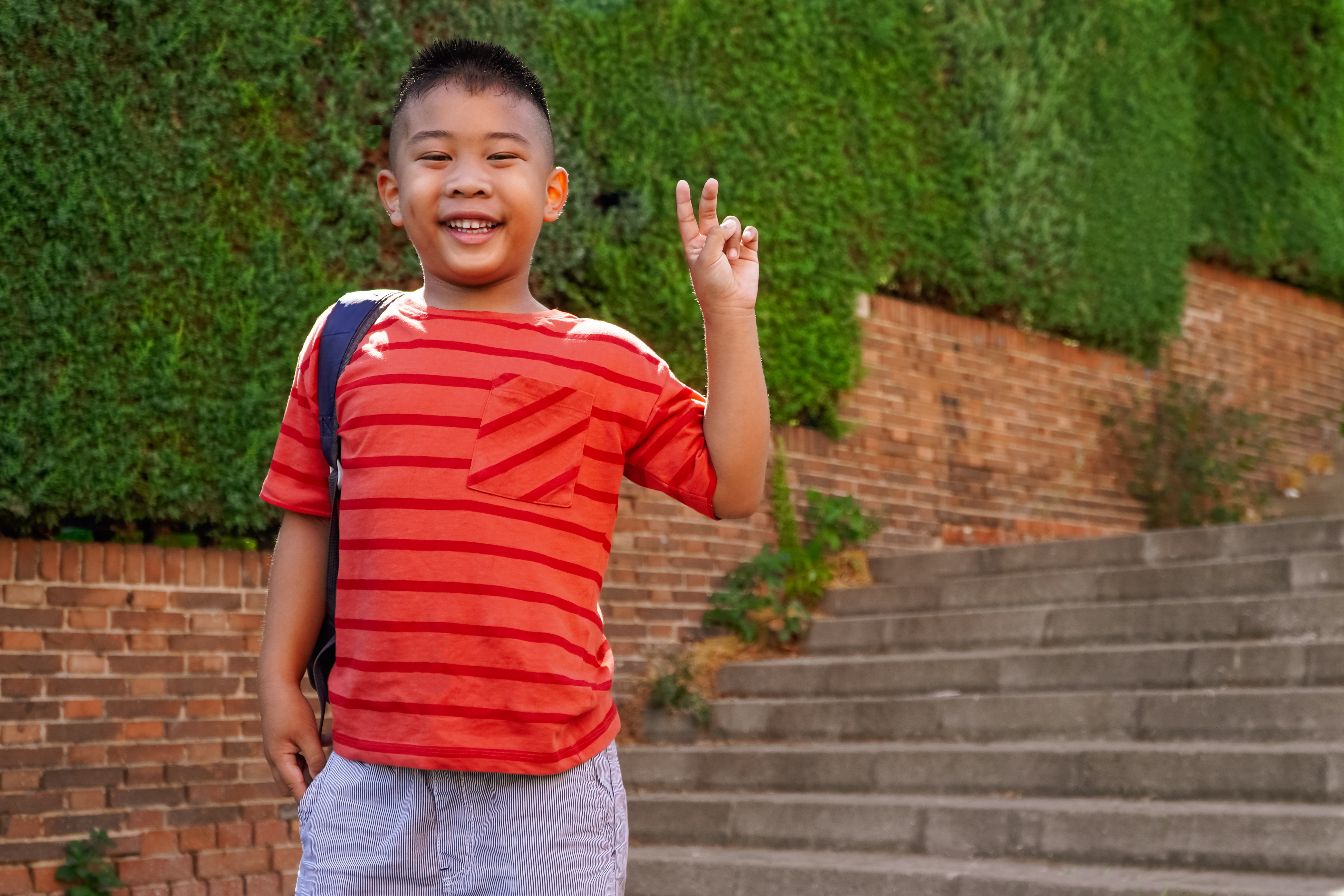 filipino-boy-with-backpack-on-the-way-to-school-2023-11-27-05-00-47-utc.jpg